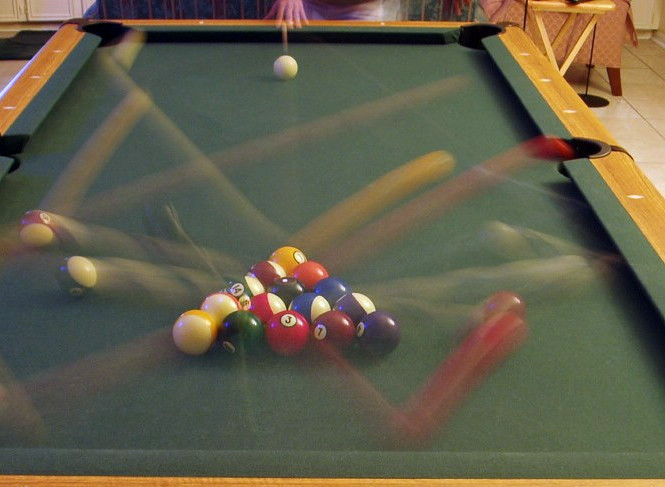 The motion streaks created by billiard balls in a long exposure of the ball break. Public domain 